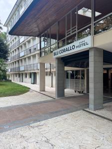 a building with a sign that reads bullet corral hospital at Hotel Blu Corallo in Marina Romea