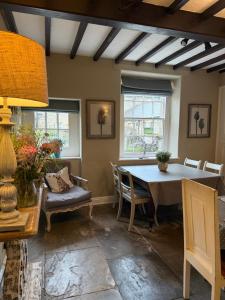 a dining room with a table and chairs at Bewerley Hall farm in Harrogate