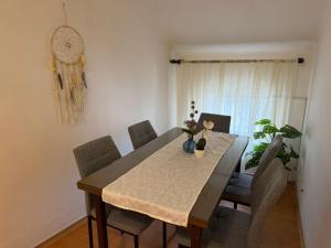 a dining room table with chairs and a dining room at Rooms delux muro in Split +14 photos