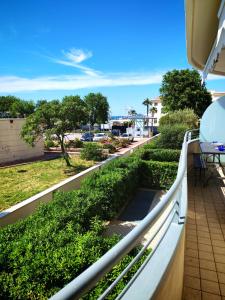 a balcony with a view of a street at VistaMare Bluemar - Garden & Sea in Cattolica