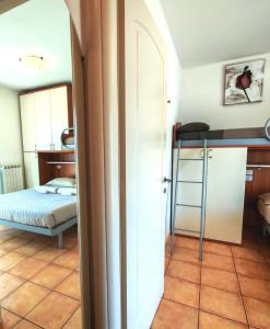 a bedroom with a bed and a bunk bed at VistaMare Bluemar - Garden & Sea in Cattolica