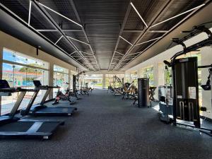 a gym with several treadmills and cardio machines at Aguativa Golf Resort in Cornélio Procópio