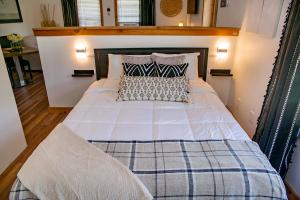 a bedroom with a large bed with a wooden headboard at The View at Harbor Lights in Hammondsport