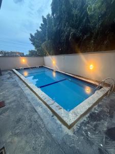 a swimming pool on the roof of a building at Mirage in Lekki
