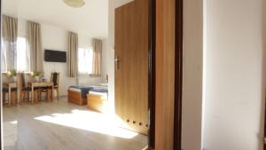 an open door to a room with a living room at Baltic Resort - Korsarz in Darłowo