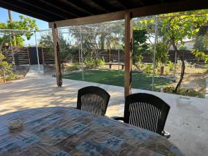 a table and chairs sitting on a patio at Friendly villagehouse in Paphos