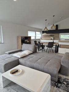 a living room with a couch and a table at Hiša Naj in Koper