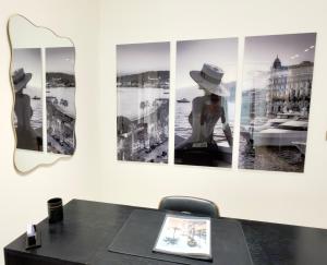 a room with a table and a mirror on the wall at Luxury Elegance Comfort 3-room apartment of 80m2 with 2 BDR 2 BA 3 min Croisette & Beach in Cannes +17 photos