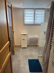 a room with a bedroom with a desk and a window at Logis Sol Levante in Arles-sur-Tech
