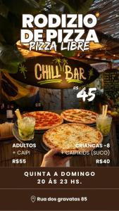 a flyer for a pizza store with two pizzas at Chill House Buzios in Búzios
