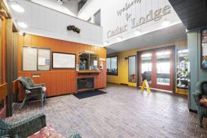 a lobby of a store with a tv in it at Cedar Lodge Condo with Private Balcony & Full Kitchen in Laconia +19 photos