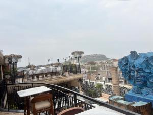 a balcony with chairs and a view of a city at The Ved Mantra in Gwalior