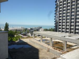 a view of a building from the balcony of a building at batumi orbi sea tawers in Batumi