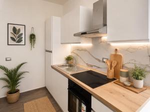 a kitchen with a sink and a counter top at Palazzo Solera in Casarano