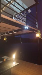 a basketball hoop hanging from a bunk bed at night at Splav Rio in Aluga