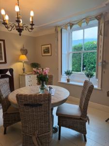 a dining room with a table and chairs and a window at Bewerley Hall farm in Harrogate +26 photos