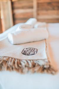 two towels are sitting on top of a table at Nînda Boutique Hôtel in Nendaz +77 photos