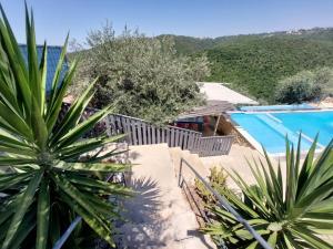 a villa with a swimming pool and a resort at Havana chalet in Jrabtā +10 photos