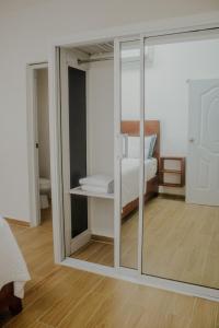 a bedroom with a sliding glass door with a bed at Villa La Dueña Las Terrenas in Las Terrenas +13 photos