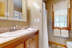 a bathroom with a sink and a toilet and a window at 205 Town Hall Road in Lower Bartlett +37 photos