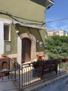 a balcony of a building with plants on it at Casa Vacanze Il Vicolo - Oliveto Citra in Oliveto Citra