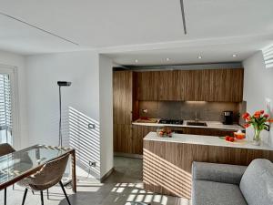 a kitchen with wooden cabinets and a counter top at Lakeview in Luino