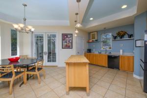 a kitchen and dining room with a table and chairs at 216 New Castle St, Rehoboth Beach in Rehoboth Beach +42 photos