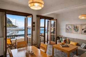 a living room with a view of the water at Matroni's House - Seafront Getaway in Monemvasia in Monemvasia
