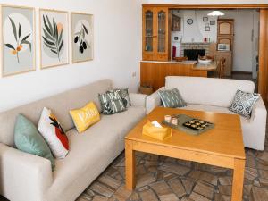 a living room with a couch and a table at Matroni's House - Seafront Getaway in Monemvasia in Monemvasia