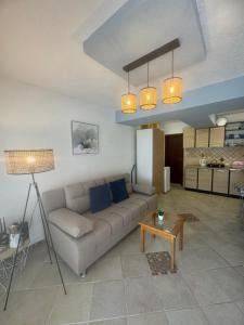 a living room with a couch and a table at Jadran5 in Petrovac na Moru