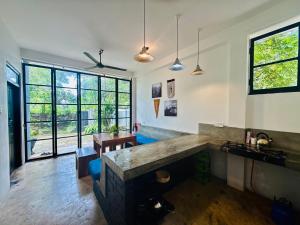 a large kitchen with a large stone counter in a room at REZ SPACE Apartment 05 in Hiriketiya
