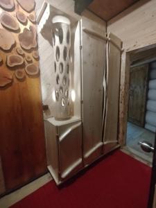 a kitchen with a refrigerator in a room at Корінь in Krasnoilov