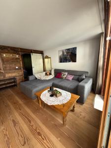 a living room with a couch and a coffee table at Apartment Andal in Lenggries