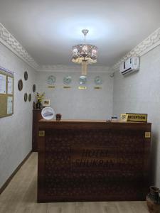 a room with a hotel shiryarmaacistacistasteryasteryasteryasteryasteryastery at Shukran hotel in Bukhara