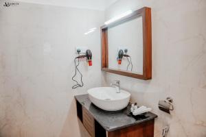 a bathroom with a sink and a mirror at Velowyn Ella in Ella +26 photos