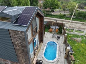 an overhead view of a house with a solar roof at Swiss House Dilijan in Dilijan