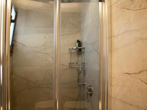 a shower with a glass door in a bathroom at Blue Dawn Kalymnos in Kalymnos +198 photos