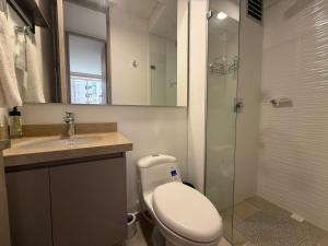 a bathroom with a toilet and a sink and a shower at Country Reservado in Gaira +10 photos