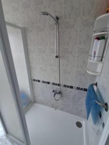 a shower with a glass door in a bathroom at Las 4 columnas (MFA) in Muxia +17 photos