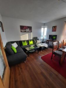 a living room with a couch and a table at Ferienwohnung in Reuterstadt Stavenhagen