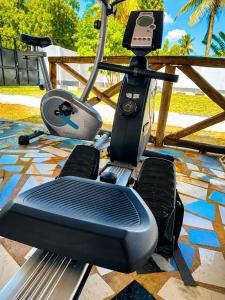 a gym with a treadmill and an exercise bike at Eden Vista Stays in Dar es Salaam