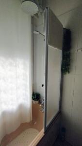 a shower stall in a bathroom with a window at La Casa di Giosy in Cairo Montenotte +31 photos