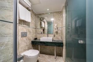 a bathroom with a toilet and a sink and a shower at Goms Hotel Old City in Istanbul +39 photos