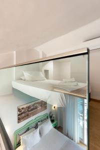 a room with two bunk beds in it at Limenaria Beach in Limenaria