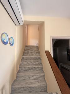 a stairway in a room with a hallway at Villa Nikoleta - Beach Front luxury villa with beach access in Akti Salonikiou