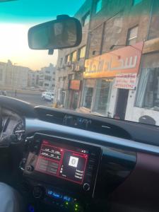 a view from the inside of a car driving down a street at Lora luxury in Al Mudawwarah