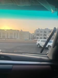 a view of a parking lot from a car window at Lora luxury in Al Mudawwarah