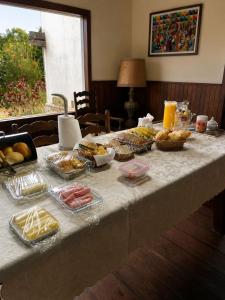 a table with a buffet of food on it at Fazenda Vista Soberba in Nova Friburgo +75 photos