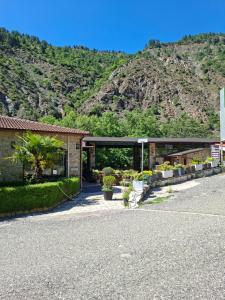 a building with a mountain in the background at Laboti Quiet Room in Librazhd