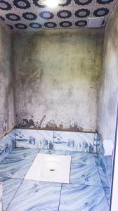an empty room with a painting on the wall at Sarvan's Khinalig Riverside Montain House in Xınalıq +25 photos